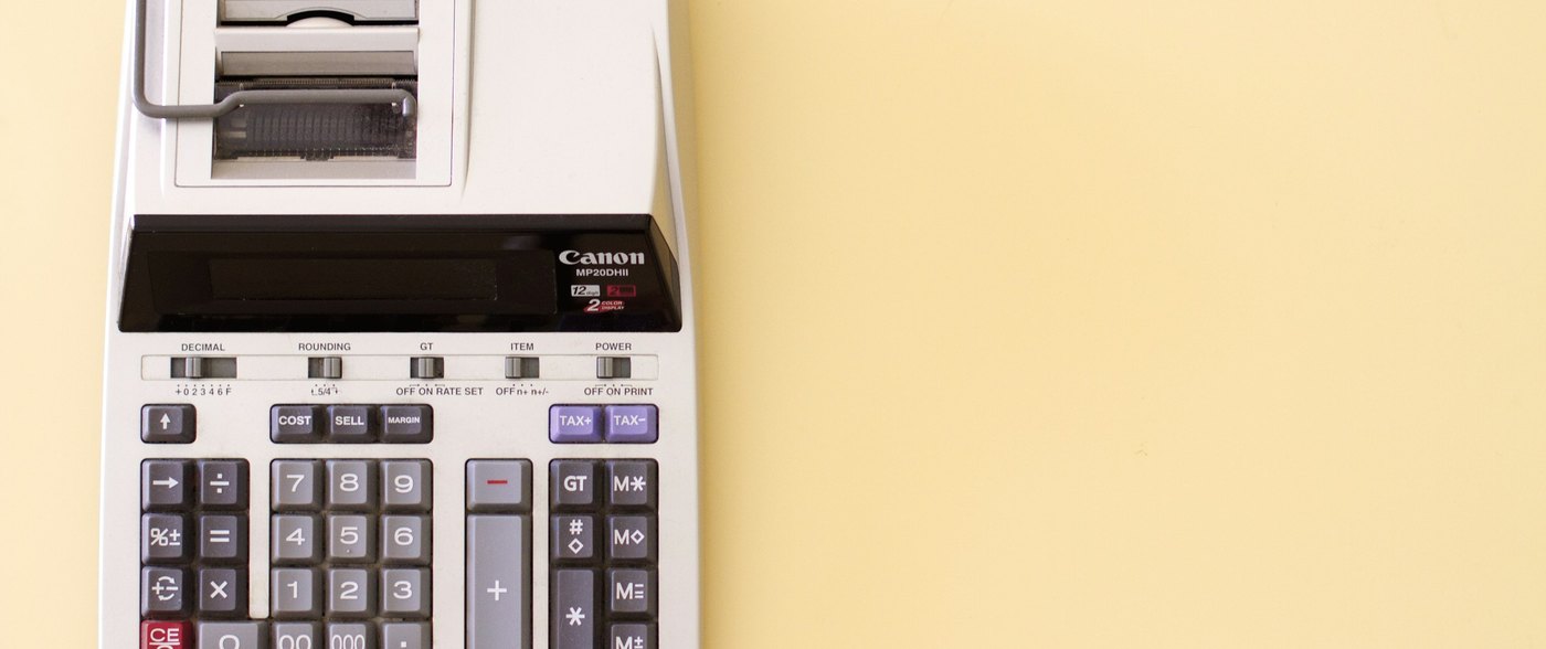 A desktop printing calculator, the kind used for running a customer statement