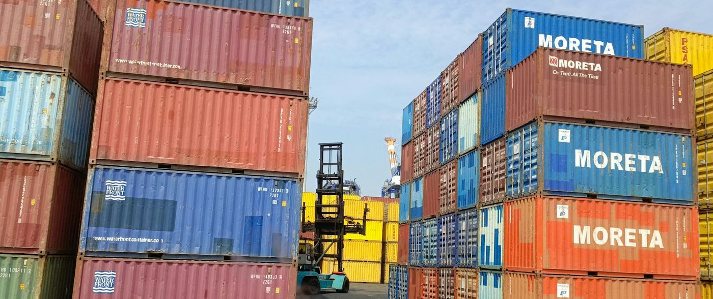 Stacked shipping containers at a port terminal